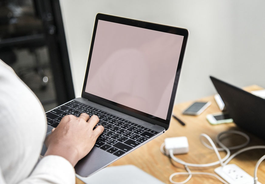 Woman using a Macbook Air