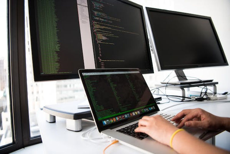 Web Developer with multiple monitors